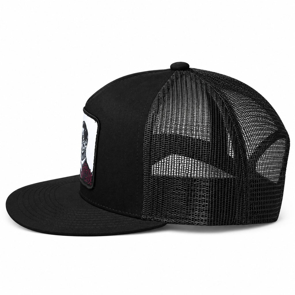 Black trucker cap with a skull and roses design on a white background - Side view
