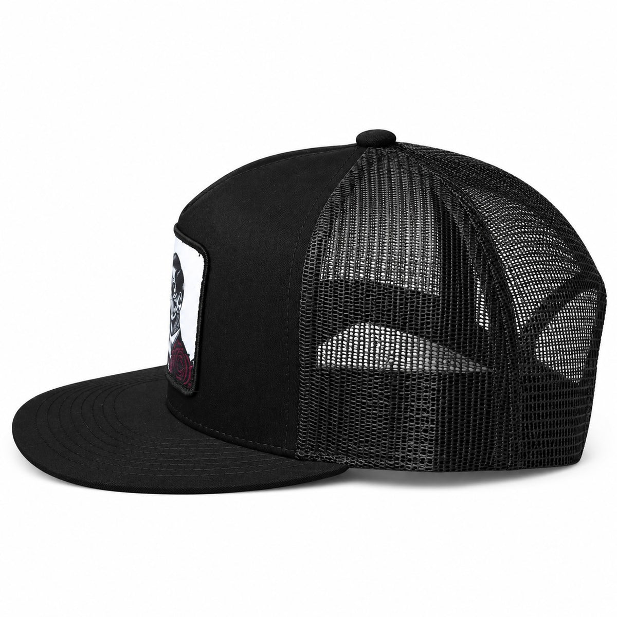 Black trucker cap with a skull and roses design on a white background - Side view