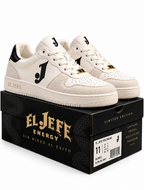 A pair of El Jefе Energy low-top sneakers in off-white and beige suede, displayed on top of their black branded shoebox against a white background.