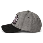 A gray hat with a black brim, featuring a small brand patch on the front.