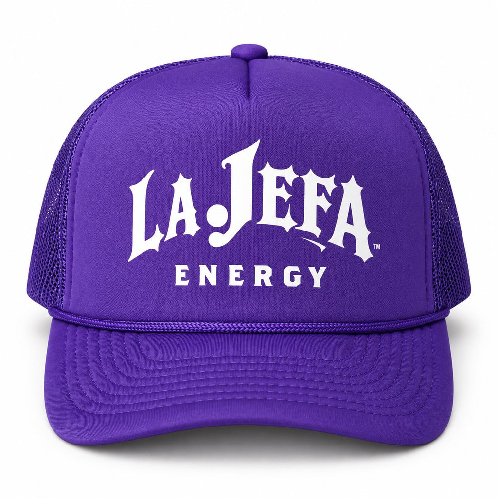 A purple trucker hat with white 'LA JEFA ENERGY' text printed on the front, shown against a plain white background.