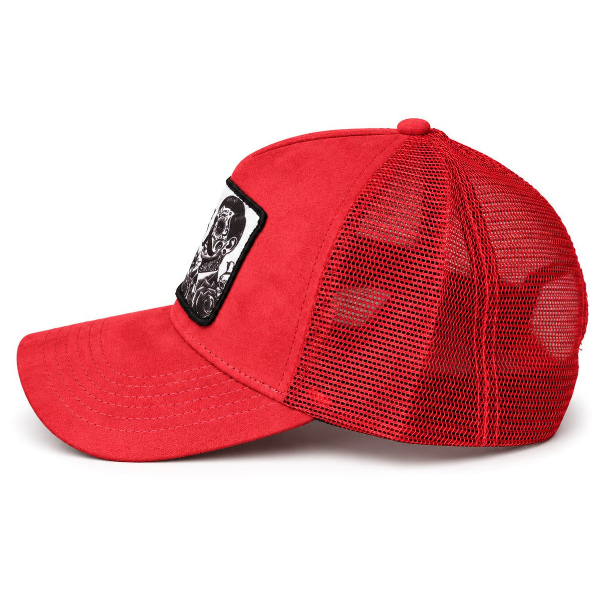 A red trucker-style baseball cap with a curved brim, red mesh back panels, and a black rectangular patch on the side featuring a white graphic illustration.